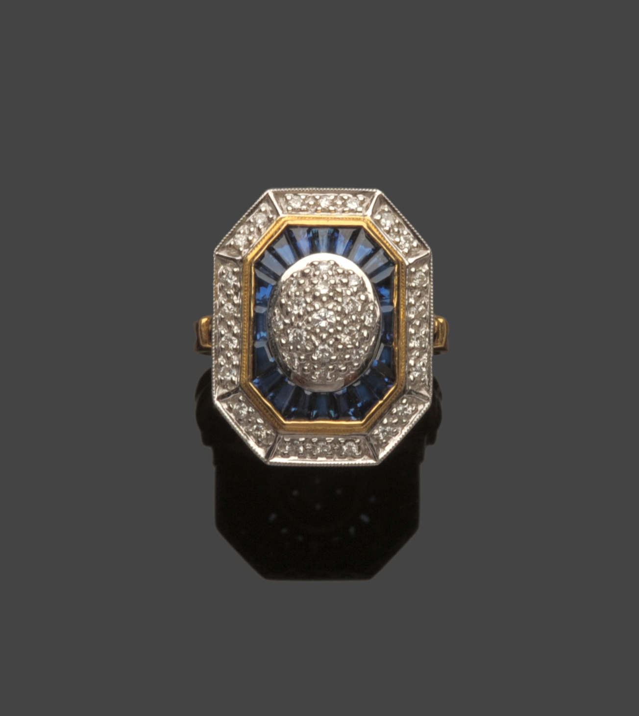 Tennants Auctioneers: An 18 Carat Gold Art Deco Style Diamond and Sapphire Cluster Ring
